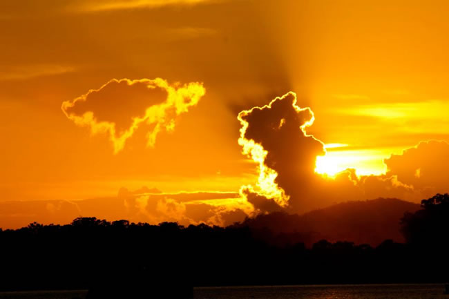 WOW! Brilliant sunrise lights up the sky. Gladstone Harbour, Queensland, Australia.