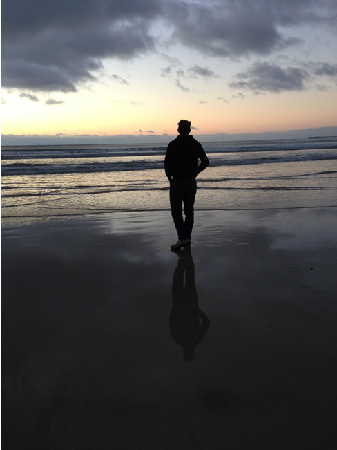 On the beach at dawn. A quiet walk on the beach gives you time to reflect, Lorne, Victoria, Australia.