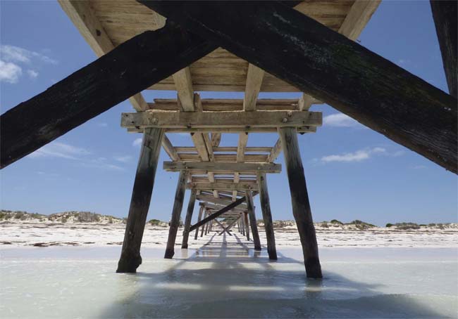 Looking underneath the abandoned jetty from the sea, at Eucla, Western Australia.