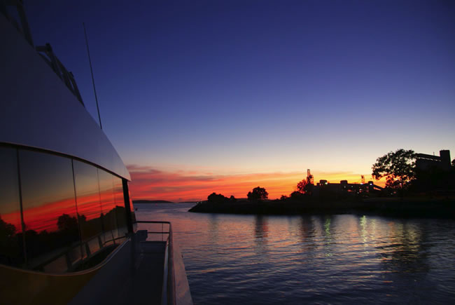 Sailing into a red dawn. Gladstone Harbour, Queensland, Australia.