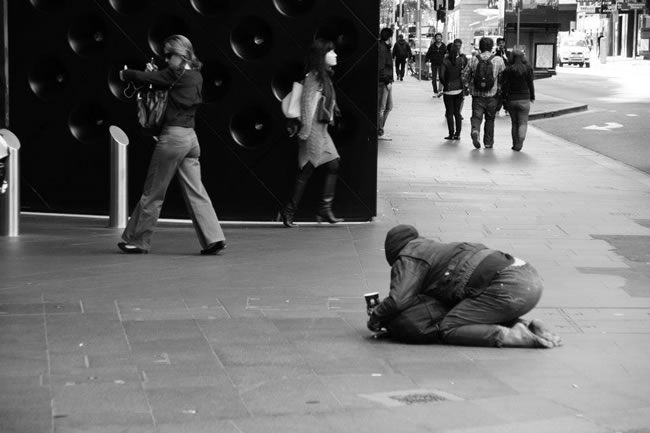 Also on the streets of Sydney - a street beggar. Sydney, New South Wales, Australia.