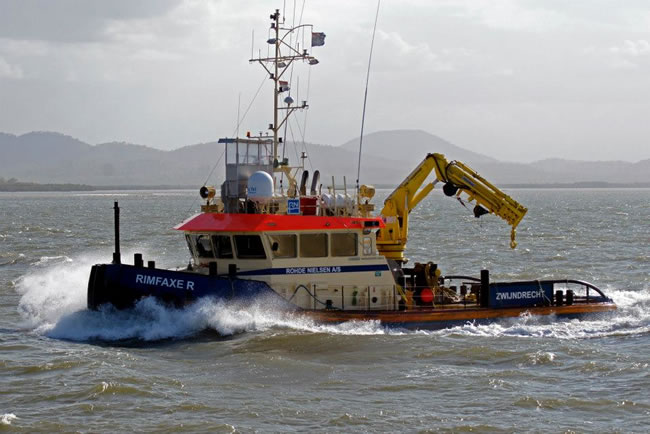 The tug Rimfaxe R on the way to work. Gladstone Harbour, Queensland, Australia.