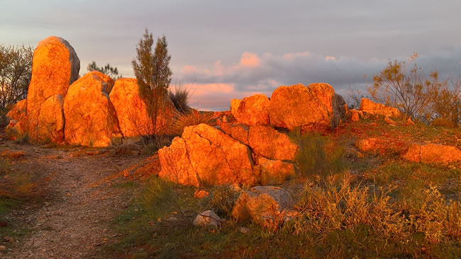 Afternoon sunlight lights up the white rocks at the White Rocks Reserve, Broken Hill, New South Wales Australia.