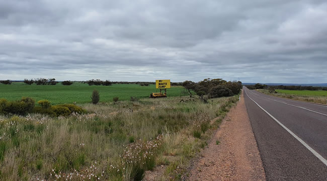 A 'Nuclear Waste Dump' sign on an old bulldozer, east of Wirrula on the Eyre Highway.