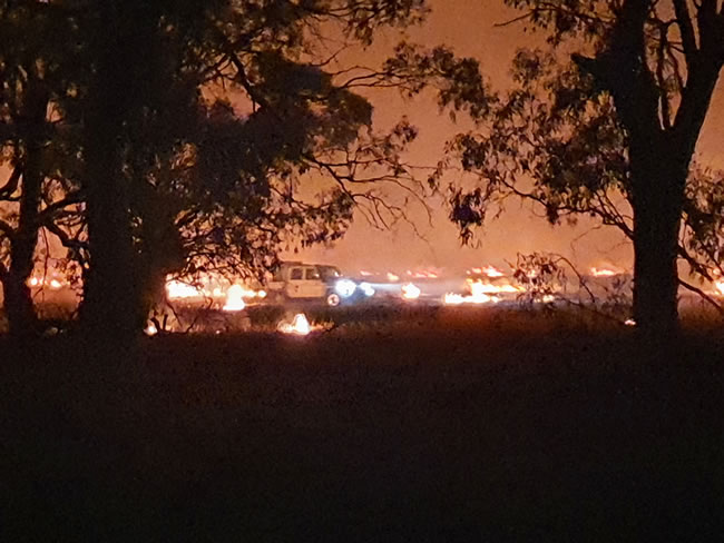 Farmers tend the stubble fire near Minyip. March 2022